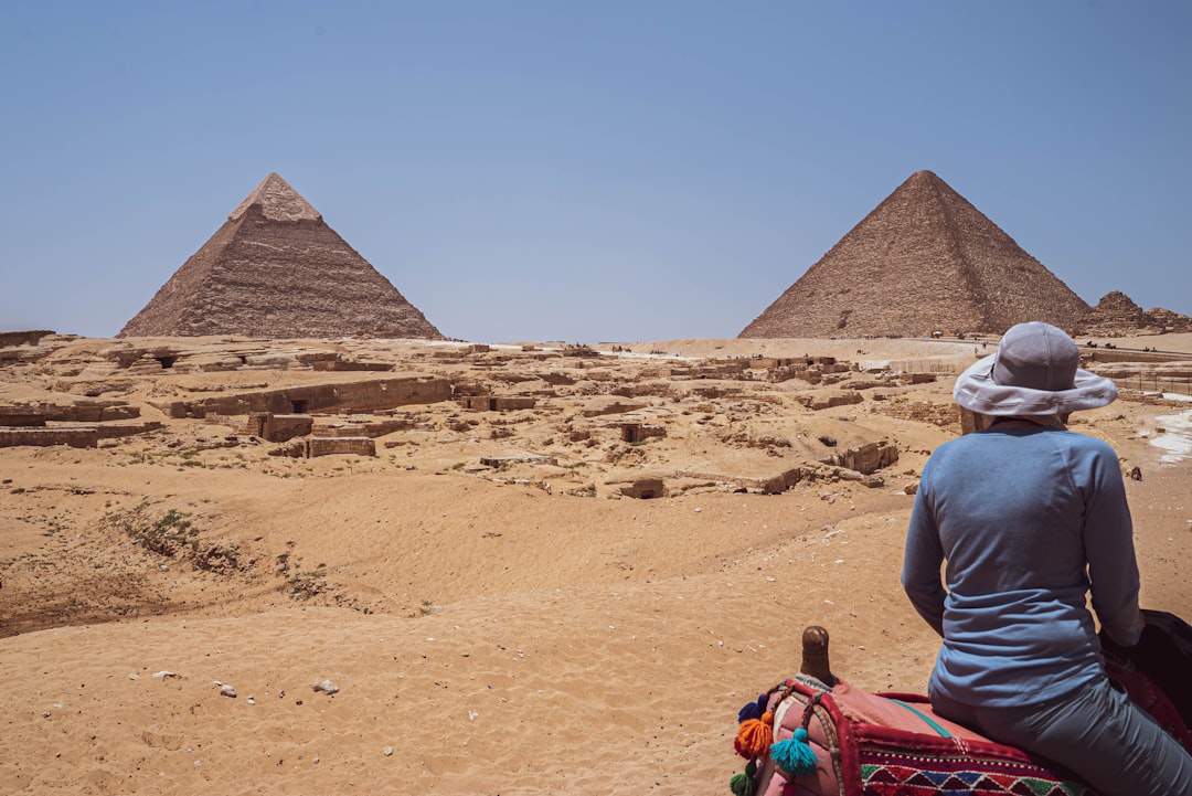 Viewing the great pyramids of Giza on camelback.