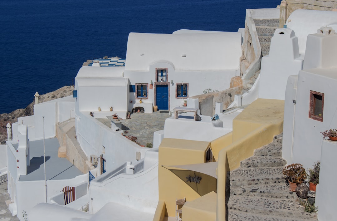 a-white-building-with-a-blue-door-and-window-gpvrjn6-1ai